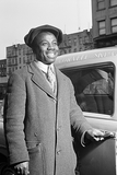 a driver opens a door on a cornell sky-view taxi cab.