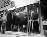 exterior of waffle shop in Washington DC. Diners can be seen through the large glass window.