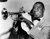 Louis Armstrong, head-and-shoulders portrait, facing left, playing trumpet. 
