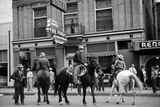 Horses with riders in the street outside the Reno bar in Billings Montana