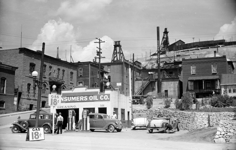 Consumer oil company gast station in butte montana in the 1930's Gas is 18 cents a gallon.
