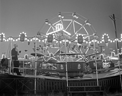 a ferris wheel and tilt a whirl carnival ride are shown.