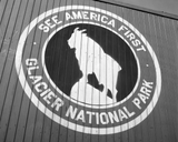 An emblem on a Chicago and Great Western Railroad freight car taken in San Bernardino California a mountain goat and the words see america first glacier national park.